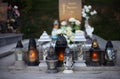 Close up of Votive candles lantern on the grave in Slovak Catholic cemetery during day. Autumn scene. All Hallows eve. Memorial Royalty Free Stock Photo