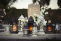 Close up of Votive candles lantern on the grave in Slovak Catholic cemetery during day. Autumn scene. All Hallows eve. Memorial