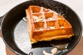 Close up waffle with caramel sauce and almond