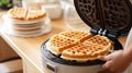 Close up of waffles baked on waffle maker iron machine. Generative AI Royalty Free Stock Photo