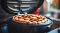 Close up of waffles baked on waffle maker iron machine. Generative AI Royalty Free Stock Photo