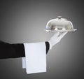 Waiter`s Hand Holding Cloche And Tray