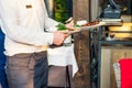 Close up waiter serving at restaurant during a banquet or other catered event. Catering or celebration concept. Service at busines Royalty Free Stock Photo