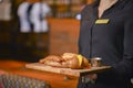 Close Up Of Waitress In Black Uniform Serving Sausages And Potato To A Guest During Lunch Time In A Pub.