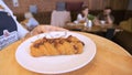 Close-up of waitress carrying tray. Stock footage. Waitress carries tray of croissants in coffee shop. Waitress carries Royalty Free Stock Photo