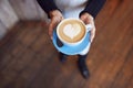 Close Up Of Waitress In Coffee Shop Holding Cup With Heart Design Poured Into Milk Royalty Free Stock Photo