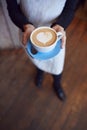 Close Up Of Waitress In Coffee Shop Holding Cup With Heart Design Poured Into Milk Royalty Free Stock Photo