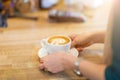 Waitress hands ready to serve a cup of coffee Royalty Free Stock Photo