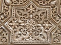 close up of wall carving in the alhambra palace, granada