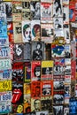 Close up of wall covered in old movie and music posters