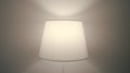 Close up of a wall lamp blinking and changing the color of the light indoors. Action. A sconce with different lights