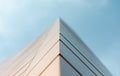 Close up wall of a modern building against a blue sky Royalty Free Stock Photo