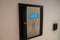 Close-up of a wall-mounted electronic safe with a keypad, digital display indicating 'Welcome, Enter User ID', and key lock, Royalty Free Stock Photo