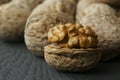 Close up walnut kernel with shell on wooden backdrop. healthy food for brain. walnut background Royalty Free Stock Photo