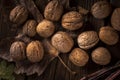 close up walnuts wooden table with leaves. High quality photo