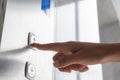 Close up waman hand press a up button of elevator Royalty Free Stock Photo