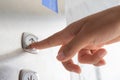Close up waman hand press a up button of elevator Royalty Free Stock Photo