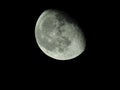 close-up of the waning three-quarter moon in the starry night sky Royalty Free Stock Photo