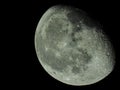 close-up of the waning three-quarter moon in the starry night sky Royalty Free Stock Photo