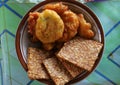 Close up of warm fried tempeh on a round plate