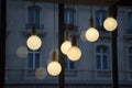 Close up warm light ceiling Lamp with reflection on window in the coffee shop at night time, evening in Paris cafe Royalty Free Stock Photo