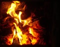 Close up of Warm orange and yellow flames burning in a fireplace Royalty Free Stock Photo