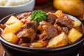 close-up of warm and steamy bowl of colombian stew, with potatoes and beef