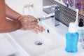 Close up of washing hands with soap under running water Royalty Free Stock Photo