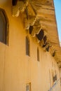 Close up of a wasp nest hanging from the ceiling of a building at outdoors, in Amber Fort near Jaipur, Rajasthan, India