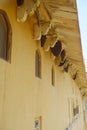 Close up of a wasp nest hanging from the ceiling of a building at outdoors, in Amber Fort near Jaipur, Rajasthan, India