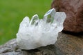 Quartz crystal cluster on a rock