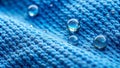 Close-up of water droplets on a blue textured fabric surface. Generative AI Royalty Free Stock Photo