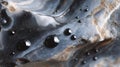 Close-up of water droplets on smooth black and blue rock surface Royalty Free Stock Photo