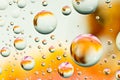 Close-up on water drops background on orange and white surface. Royalty Free Stock Photo