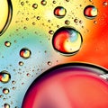 Close-up on water drops background on rainbow colors surface. Wa Royalty Free Stock Photo