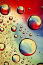 Close-up on water drops background on rainbow colors surface. Wa Royalty Free Stock Photo