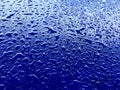 Water drops on blue plastic surface background Royalty Free Stock Photo