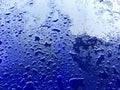 Water drops on blue plastic surface background Royalty Free Stock Photo