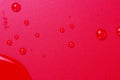 Close up of water drops on dark red tone background. Abstract red wet texture with bubbles on plastic PVC surface or grunge. Royalty Free Stock Photo