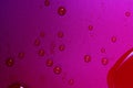 Close up of water drops on dark red tone background. Abstract red wet texture with bubbles on plastic PVC surface or grunge. Royalty Free Stock Photo