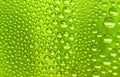 Close up water drops on light green tone background. Abstract sky light green wet texture with water drops on glass surface. Royalty Free Stock Photo