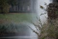 Close up of the water fall in a park with mist rising above the water with a space for text. Royalty Free Stock Photo