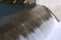 Water falling over dam during rainy season Royalty Free Stock Photo