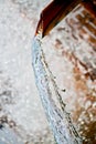 Close up of water gushing out of the pipe Royalty Free Stock Photo