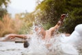 Close-up of water huge splashing in pond from people falling into water