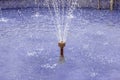 Close-up of a water nozzle of a fountain in operation Royalty Free Stock Photo