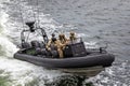 Close up of Water Police in camoflauge on high speed RIB on surveillance patrol on the Swan River, near Perth, Australia