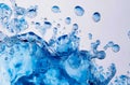 A close up of water splashing out of a blue glass Royalty Free Stock Photo