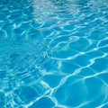 A blue pool with ripples in the water (ai generated) Royalty Free Stock Photo