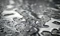 Close-up of waterdrops on silver surface. Royalty Free Stock Photo